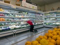 BANGKOK, THAILAND - MAY 25: Unnamed Makro employee organizes fresh produce on the refrigerated shelf in Bangkok on May 25, 2023.