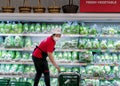 BANGKOK, THAILAND - MAY 02: Unnamed staff fill up refrigerated shelves with fresh produce in Makro supermarket on Petchkasem in