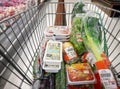 BANGKOK, THAILAND - MAY 12: Various commercial products fills up a shopping cart belonging to an unknown shopper in Foodland