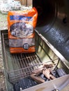 Bangkok, Thailand - May 12, 2018: Western Mesquite BBQ Smoking Chips and Charcoal in Portable Barbecue Grill on back yard