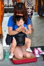 Bangkok, Thailand: Mother & Son Praying at Shrine Royalty Free Stock Photo