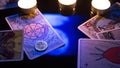 Bangkok, Thailand, Nov.13.19: Christmas divination by candlelight on Tarot cards. Cards for divination on a black background with