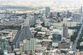 Bangkok, Thailand - Nov 20, 2018: Cityscape aerial top view of tall buildings, homes, road traffic, and under construction site Royalty Free Stock Photo