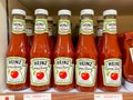 Many bottles of Heinz ketchup on the shelf for sale in Foodland supermarket