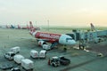 Loading luggage into airplane and the engineers maintaining the airplane in Don Mueang International Airport