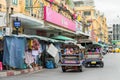 Scenic view of a row of tuk tuk parking along the Khao San road and the drivers waiting for the customer