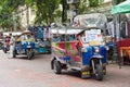 Scenic view of a row of tuk tuk parking along the Khao San road and the drivers waiting for the customer