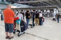 Bangkok, Thailand - November 29, 2023 : asian and europe travelers passengers are in queue to check in at airline counter to