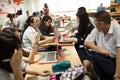 A group of students in a classroom working together on an exercise