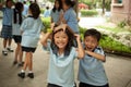 In a college in Bangkok, children have fun in the playground during the break