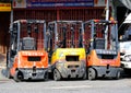 Forklifts parked on a Bangkok street