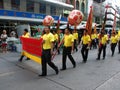 A group of people carrying banners in the parade in a Festival of the Clans of the Chinese community of Bangkok Royalty Free Stock Photo