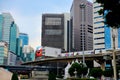 Modern urban image with BTS skytrain transport and skyrise buildings central Bangkok Thailand