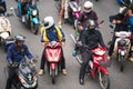 BANGKOK, THAILAND - NOVEMBER 28, 2016 : Motorcyclists wait for a green light at intersection with crosswalk on the city road.