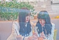 BANGKOK, THAILAND - NOVEMBER 23, 2018: Natherine and Ratah, members of Thai Idol girl group BNK48, eat breakfast before attending