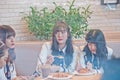 BANGKOK, THAILAND - NOVEMBER 23, 2018: Natherine, Ratah, Pukkhom, members of Thai Idol girl group BNK48, eat breakfast before