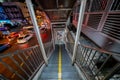 Bangkok, Thailand - November 28 2019: Pedestrians climbing stairs of Crossroad footbridge to cross the road