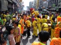 People following two dancing lions in a Festival of the Clans of the Chinese community of Bangkok