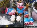 Small sculptures of pigs deposited as an offering at the Pig Memorial. Bangkok Pig Monument