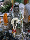 Stone sculpture with pearls and flowers deposited as an offering at the Pig Memorial. Bangkok Pig Monument