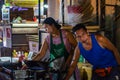 BANGKOK, THAILAND - NOVEMBER 2018: Thai muslim couple are preparing and cooking thai food in the evening on the night market