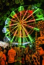 Unacquainted Thailand people or tourist walking and Local Ferris wheel in `Loi Krathong ` Festival