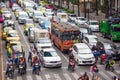 BANGKOK, THAILAND - NOVEMBER 28, 2016 : Vehicles motorcycle, bus, car and taxi wait for a green light at intersection with cross Royalty Free Stock Photo