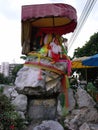 Vertical view of the bronze rock sculpture depicting a pig at the Pig Memorial. Bangkok Pig Monument