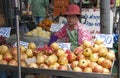 BANGKOK, THAILAND-October 10TH 2010: A woman sells pomegranate f