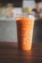 Bangkok, Thailand - October 12, 2020 : Iced Thai milk tea in container that can be decomposed naturally in Inthanin coffee shops