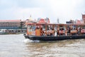 Bangkok, Thailand - October 3, 2018: Passenger boats crossing the Chao Phraya River with historic culture scene. Bangkok, Thailand