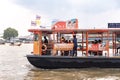 Bangkok, Thailand - October 3, 2018: Passenger boats crossing the Chao Phraya River with historic culture scene. Bangkok, Thailand