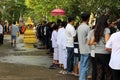 Bangkok, Thailand - October 18, 2016:People line up at temple in the end of Buddhist Lent Day. Before there put food to a Buddhist