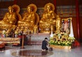 Thai woman pay respect to image of the late king Bhumibol Adulyadej