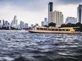 Bangkok Thailand river of Bangkok and skyscraper high rise building cityscape riverscape taxi boa