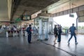 Bangkok, Thailand - 26 Sep 2020, Local Passenger pass the gate at Airport Rail Link, Ladkrabang Station with Security Guard checks Royalty Free Stock Photo