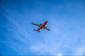 Bangkok, Thailand - 26 Sep 2020, the red yellow AeroPlane is flown in the open sky at afternoon time at Bangkok, Thailand Royalty Free Stock Photo