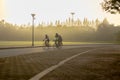 Bangkok Thailand - 15 Sep 2019 : Three men riding on bicycle in Suan Luang Rama IX public park in morning.