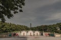 Three Traditional chinese graves are at Chinese cemetery are against the modern building and sky background Royalty Free Stock Photo