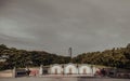 Three Traditional chinese graves are at Chinese cemetery are against the modern building and sky background Royalty Free Stock Photo