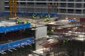 Unidentified construction workers working at high level of construction site in Bangkok,Thailand