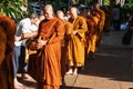 Bangkok, Thailand, September, 2019 - on buddhist holy day Thai buddhist monks with alms bowl walking in row to recieve food Royalty Free Stock Photo