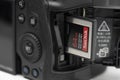 View of the New Canon EOS R5 Mirrorless Camera with the new Sanddisk CF Express Card Royalty Free Stock Photo