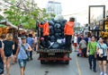 Bangkok, Thailand - September 29, 2018 :  garbage man collecting garbage to the truck among crowd of tourist and people Royalty Free Stock Photo