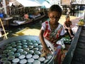 A girl prepares a dessert at the Taling Chan Floating Market in Bangkok