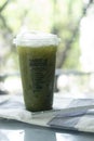 Bangkok, Thailand - September 14, 2021 : A glass of iced green tea from cafe Amazon are found in every province in Thailand