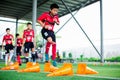 BANGKOK, THAILAND - SEPTEMBER 16, 2018 : Kid soccer jump cross cone marker Royalty Free Stock Photo