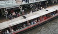 Passengers getting in a ferry boat at Pratunam Pier