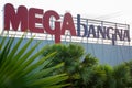 Bangkok, Thailand: a sign board of Megabangna Shopping Mall with palm trees in the foreground.