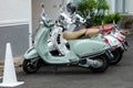 Three new Vespa motorcycles parked Royalty Free Stock Photo